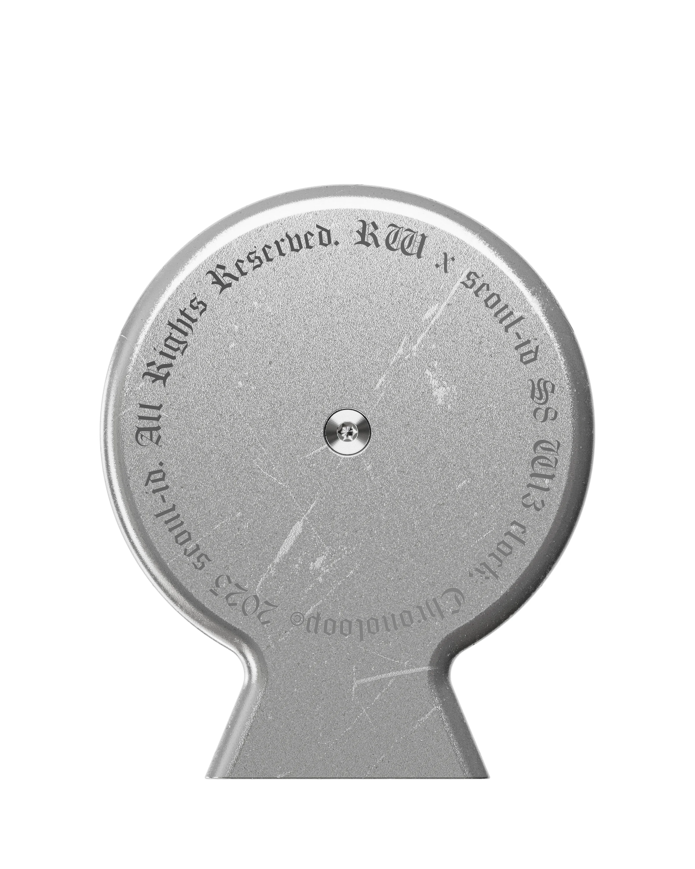 Front detail of the worn silver Chronoloop end cap with circular blackletter typography