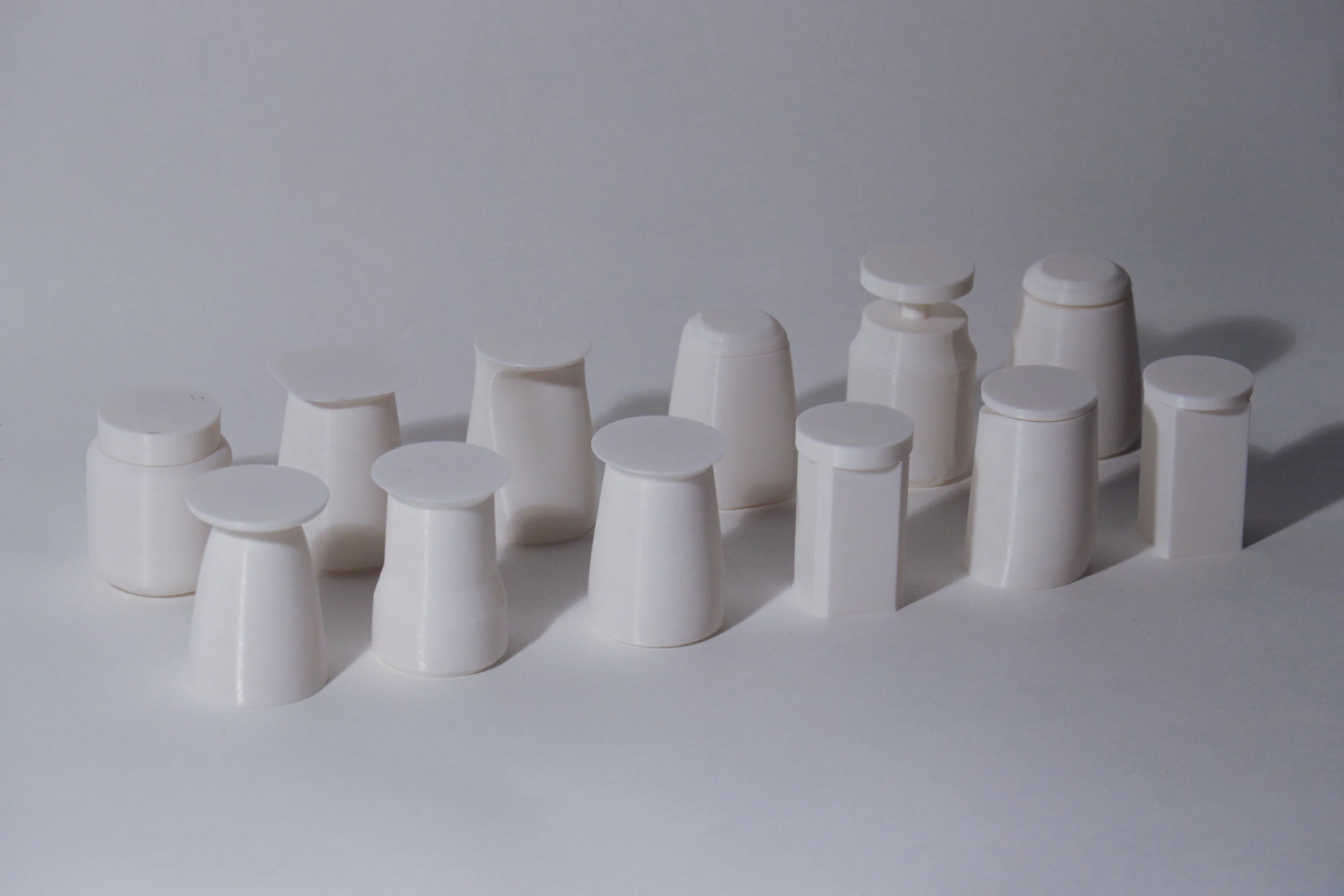 Small white scale models exploring the Cor! body and tabletop proportions