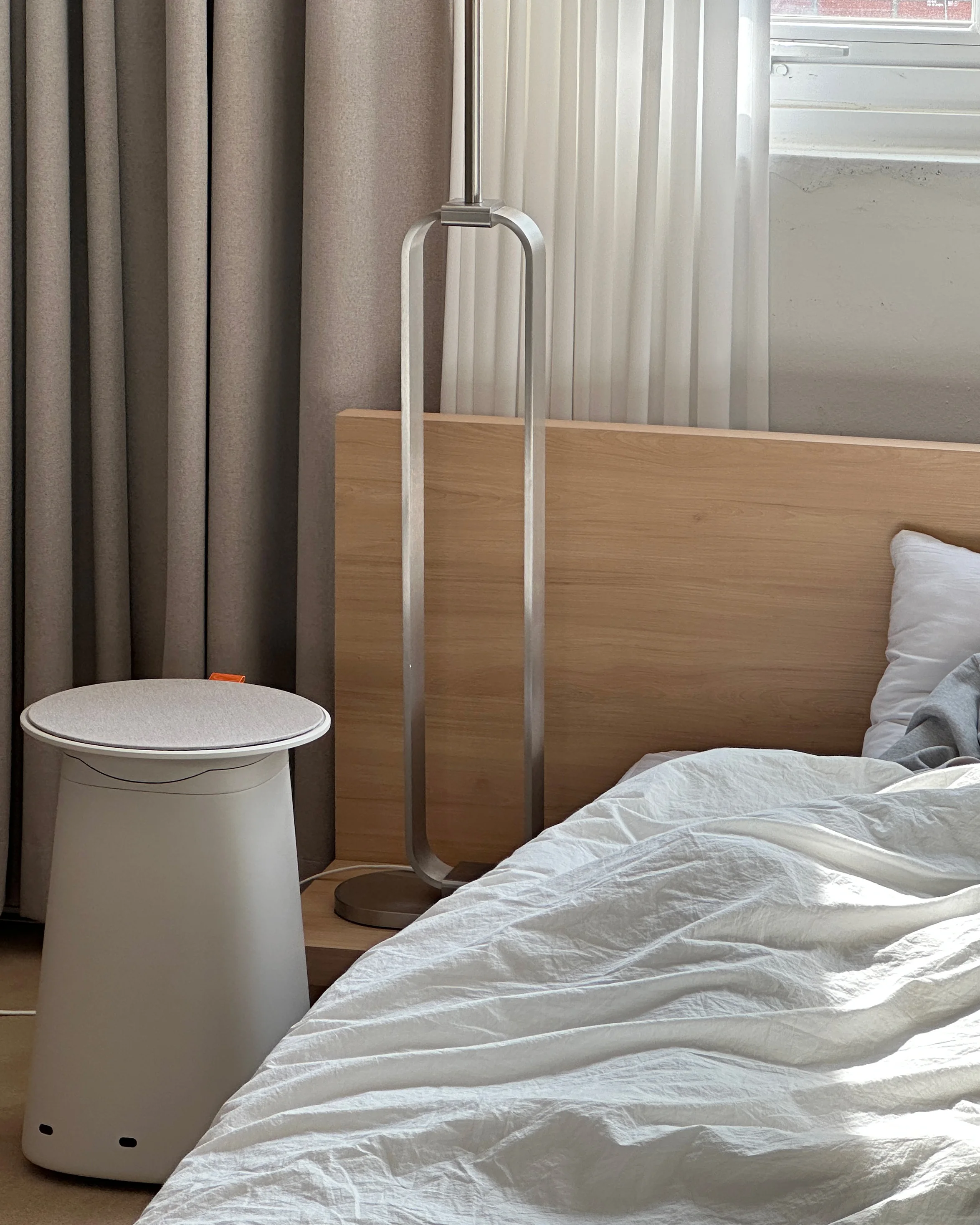 Cor! appearance prototype positioned beside a bed for an in-context evaluation