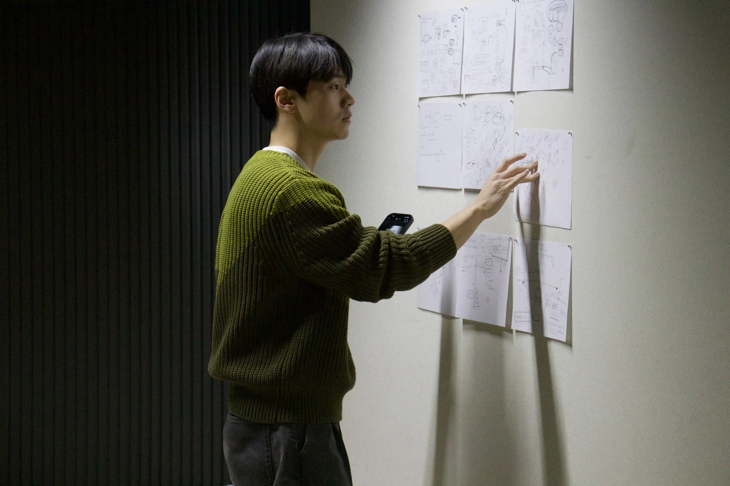 Designer reviewing early NXC concept sketches