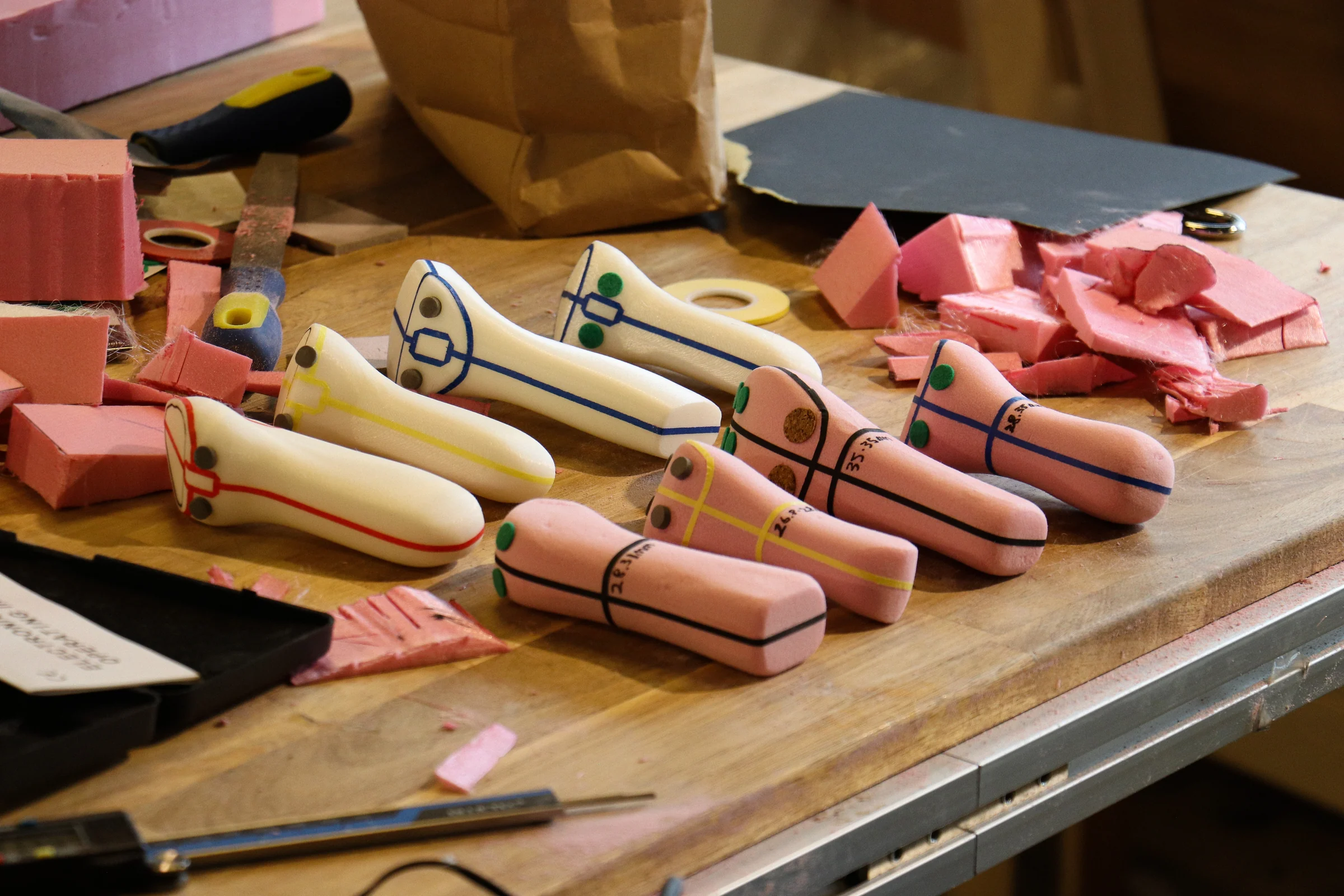 Multiple NXC grip prototypes with color and detail markings