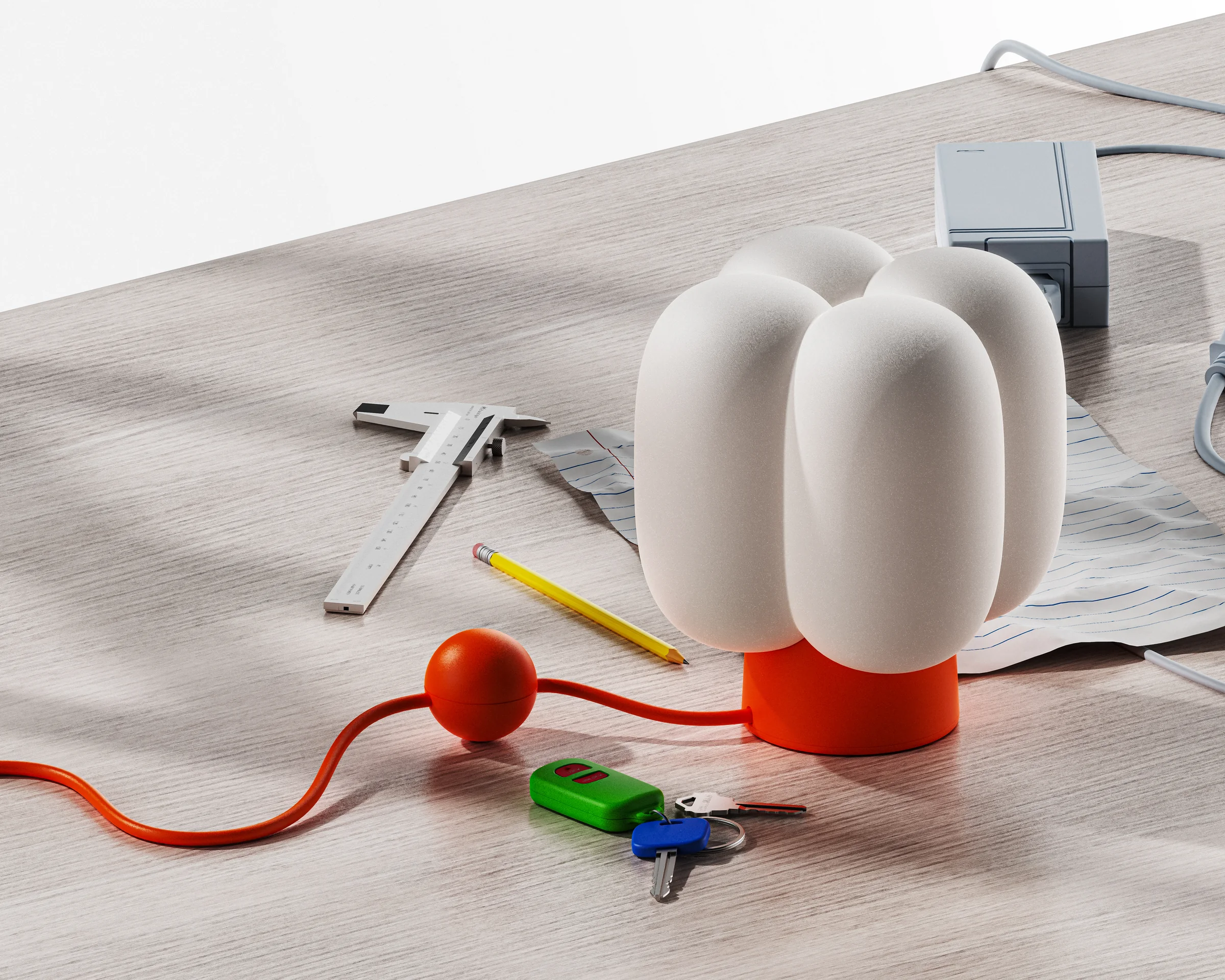 Project Present 2024 clustered lamp placed on a designer's workbench