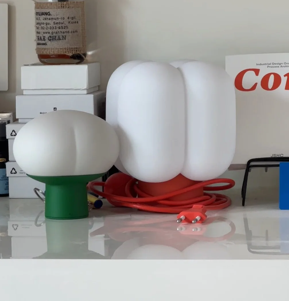 3D-printed Project Present 2025 lighting prototypes on a workbench