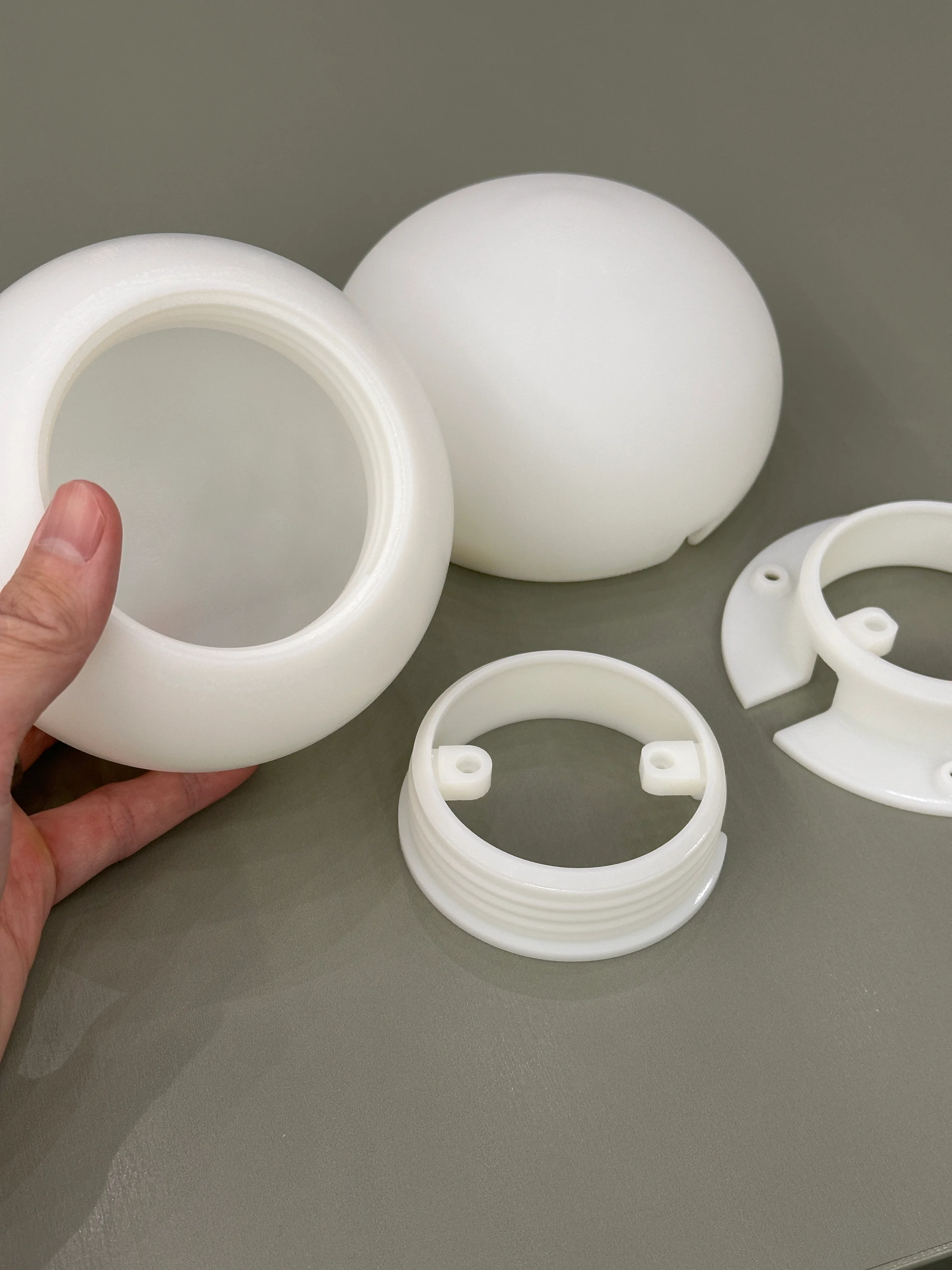 Disassembled 3D-printed lamp housing from Project Present 2025